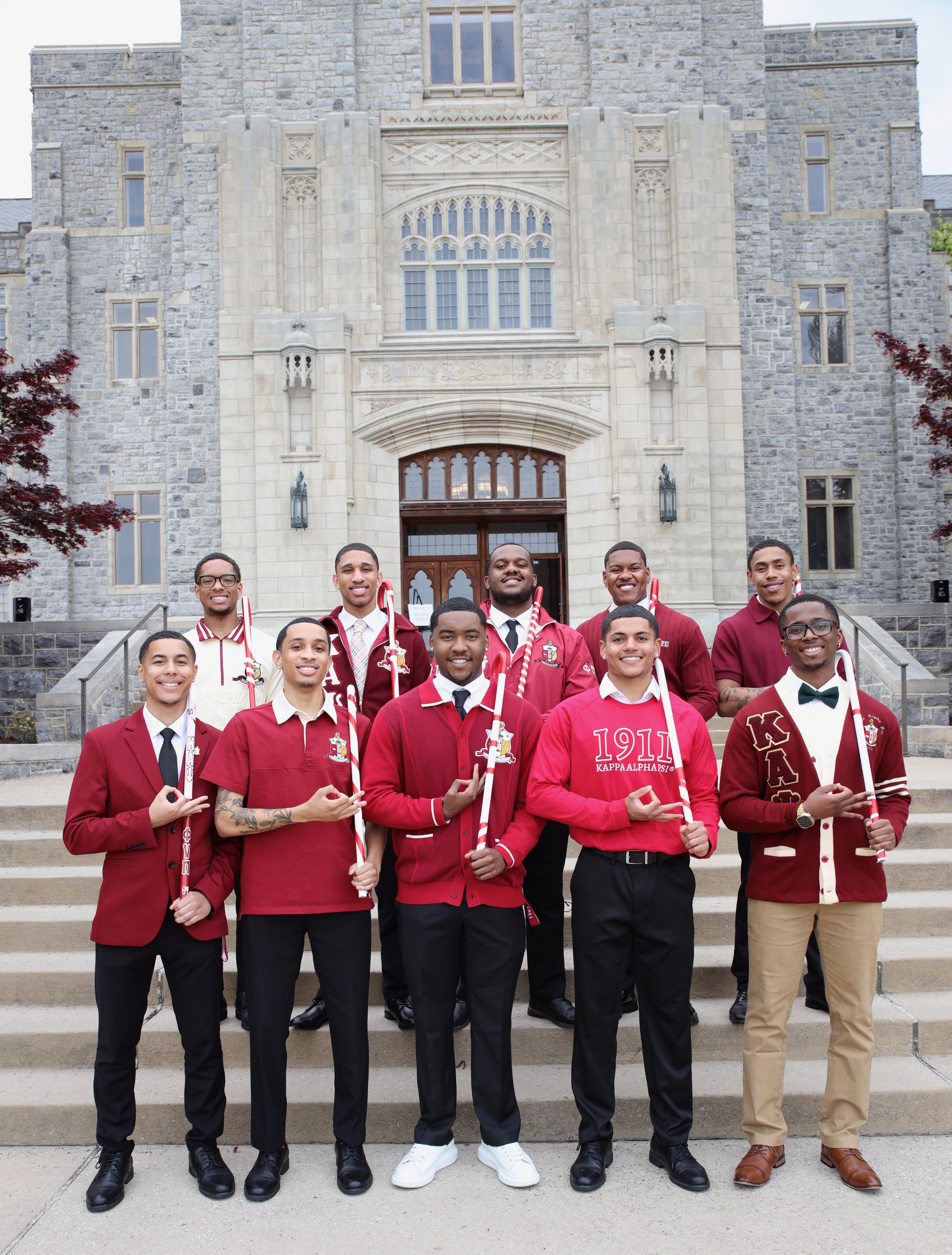Group of men standing outside of building