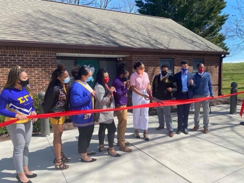 members of NPHC participating in ribbon cutting ceremony